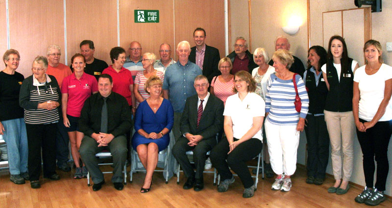 Minister Mark Drakeford AM (seated) with walkers and staff of Monmouthshire’s leisure services