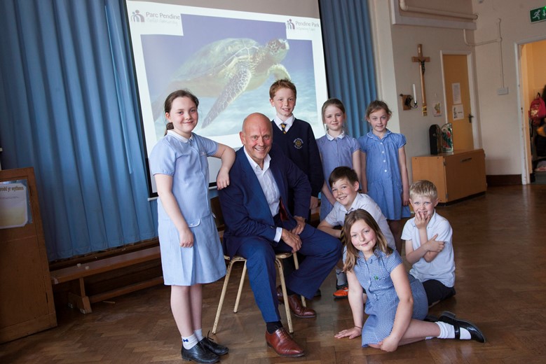 Pendine Park.... Mario Kreft visits Trefnant school where he used to go as a boy and talks to pupils. Pictured is Mario Kreft with Pupils Lillie Young, Millie Maxwell, Thomas Evans, Will Kellett, Charlie Porter, Hattie Orton and Olivia Schrimshaw.