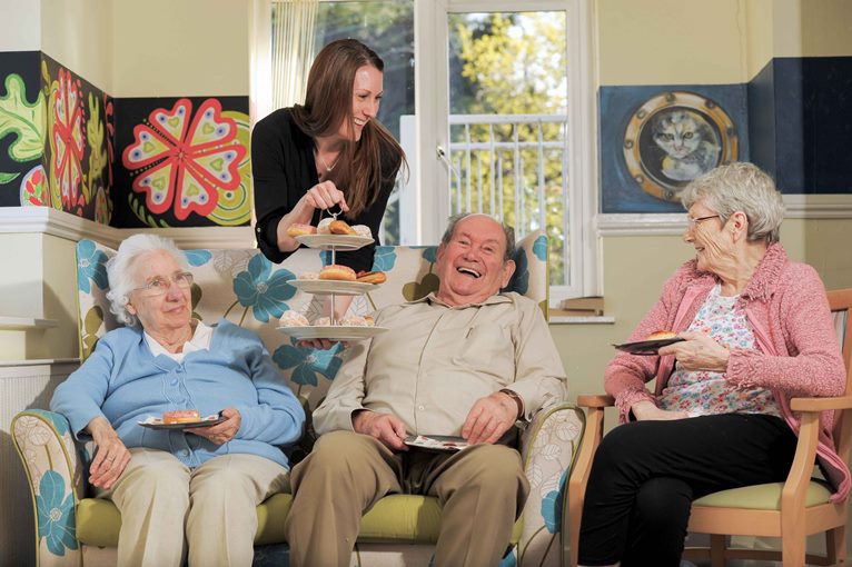 Rowan House Care Home, Griffithstown, Pontypool, where the residents enjoy an old fashioned tearoom. Emily Baines, Admin Assistant, middle, serves the cakes to left to right, Marjorie Andrews, aged 77, John Symons, aged 83, and Liz Vowles, aged 76.