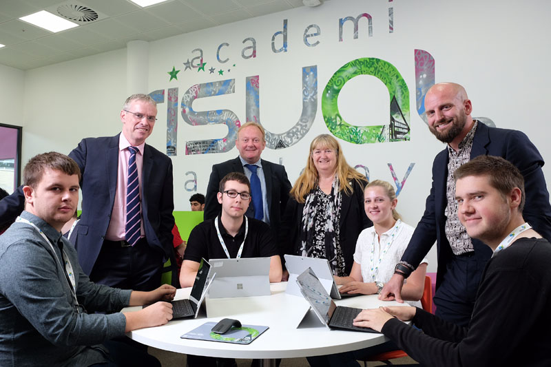 Microsoft UK Director of Education Steve Beswick, CAVC Principal and Chief Executive Mike James, Minister for Skills and Technology Julie James and risual Director and Co-owner Alun Rogers with CAVC IT students (l-r) Jeffrey Ross, James Holloway, Ella Jenkins and Bradley Le Breuilly