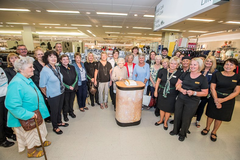 Marks & Spencers 80th birthday. Former staff joined present day staff to celebrate the celebrations with 98 years old Em Hughes cutting the cake.