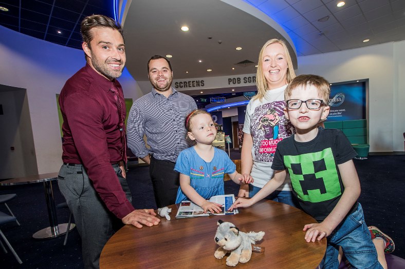 Evan McLeod-Andrews, 8 with mum Kelly, sister Riley, 5 with Odeon managers at Eagles Meadow, Dan Cheesbrough, left andf Steve Short.