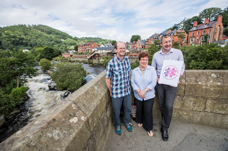 Llangollen shopkeepers are supporting Denbighshire County Council's #LoveLiveLocal online marketing campaign. Pete Carroll, left, of Pro Adventure outdoor shop, Jan Deeprose of Lily Rose Interiors, and Steve Jones of Stans supermarket.
