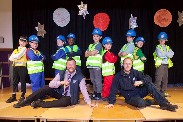 Pupils from Ysgol Bro Dyfrdwy in Cynwyd enjoyed a Christmas show with a difference with youngsters performing a Rap about Ifor Williams Trailers. Pictured: Ifor Williams Trailers' Rob Small and Geraint Jones along with rappers, year 5 & 6 pupils.