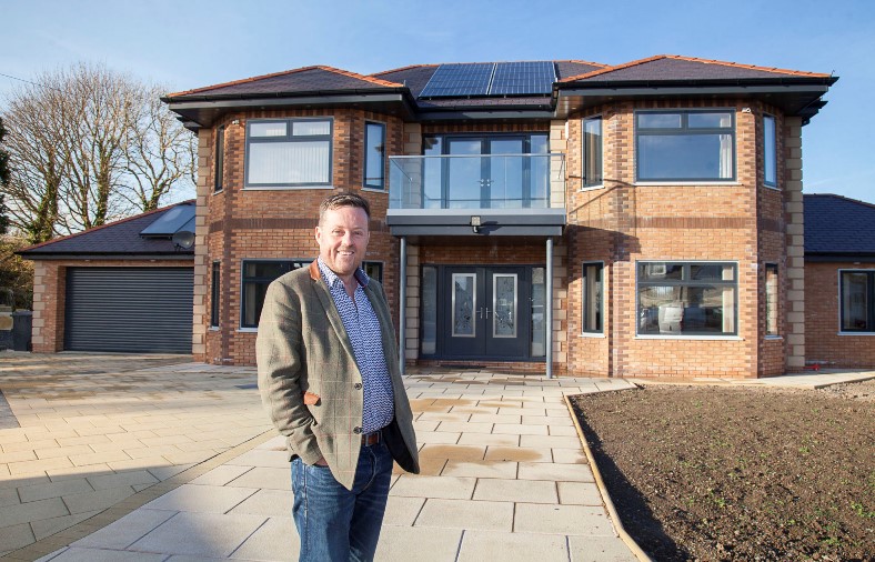 Peninsula Home Improvements proprietor Ken Grayson visits the home of Marin Fell which is one of the first in the UK to install LUMI windows and doors in his newly built home in Angelsey.