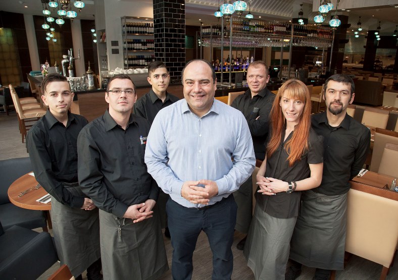 A new Turkish Restaurant in Eagles Meadow in Wrexham "Turquoise" has opened for Business. Pictured" Proprietor Cevdet Mutlu with some of his many staff