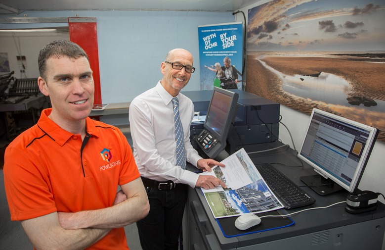 Powlsons the printers at Colwyn Bay,  £70,000 investment in a new digital printing machine that will safeguard jobs and bring more business into the town. Pictured are  James Large and MD, John Jones.