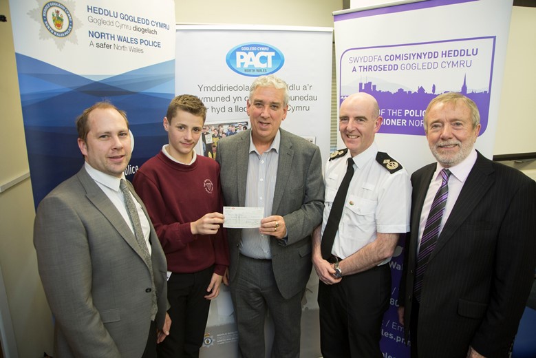 Pictured at the Your Community Your Choice awards are, from left, Denbighshire winners Prestatyn High School Young Rangers, from left, student liaison officer James Williams and pupil Sean Mahar, with North Wales Police and Crime Commissioner Arfon Jones, Deputy Chief Constable Gareth Pritchard and David Williams, chairman of the Police and Community Trust.