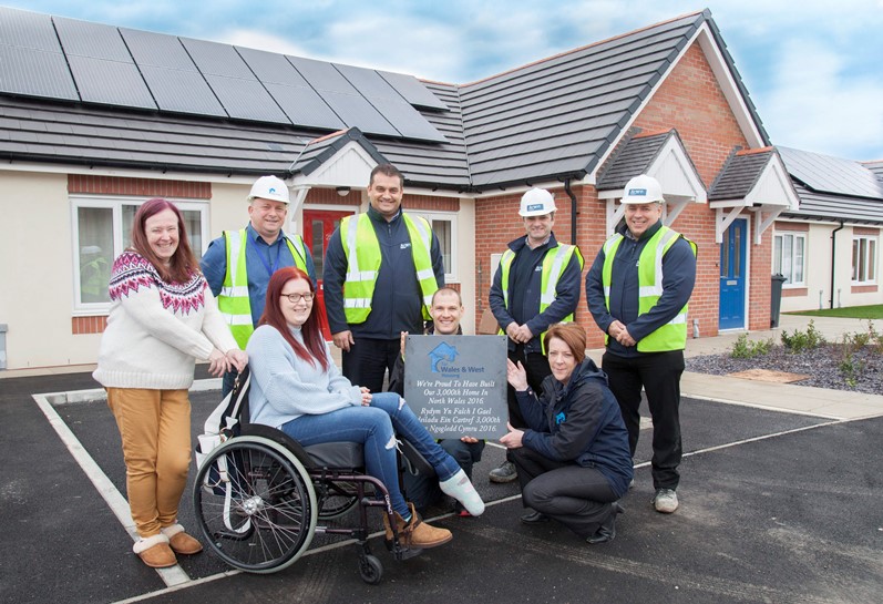 Wales and West Housing celebrate their 3000th home built in North Wales in 2016 by Anwyl Homes. Pictured: Residents Danielle Morgan and her mum Sue Morgan who live at Tir Glas in Greenfield celebrate the occasion with Wales & Wests Thomos Torok and Ann-Marie Rastin with the plaque along with Ian Gillespie and Anwyl Homes' Simon Rose, Peter McDonald and Lee Hildebrandt