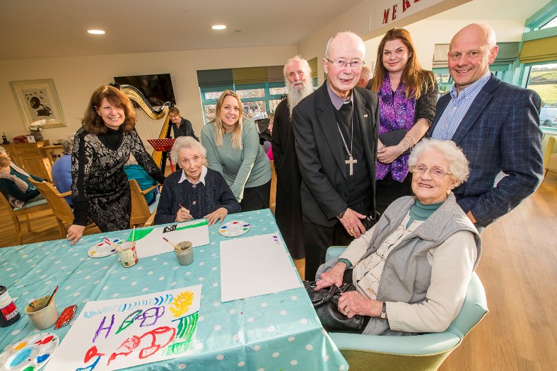 Bryn Seiont Newydd, Caernarfon. Father Deiniol and Bishop Edwin visited to give their blessing to the premises. Pictured from left, Gill Kreft, resident Mic Foster, Nia Davies Williams, manager Sandra Evans, Father Deiniol,  Bishop Edwin, Sarah Edwads, resident Daphne Egan and Mario Kreft.