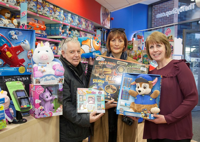 The Entertainer at Eagles Meadow in Wrexham have donated £750 to the Charity Nicola's Fund raised by local customers donating at the till on their debit cards when purchasing toys. Pictured: Steve and Debbie Riley along with Assistant Manger Vicky Smallwood