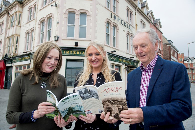 Pictured outside one of the Ministry of Food offices in Colwyn Bay are Authors Cindy Lowe, and Graham Roberts, along with Anna Openshaw  (CENTRE) of the Colwyn Bay BID organisation which is organising a 1940s festival and exhibition. and are appealing for people to submit memorabilia for an exhibition to be featured as part of the festival.