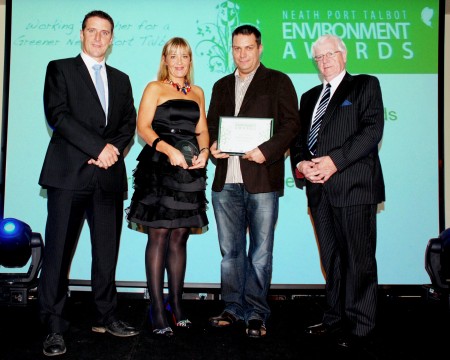Accepting the award for overall winner from Council Leader Ali Thomas (far right)are Managing Director Mark Davies and Debbie Robinson. Also pictured is presenter Iolo Williams (far left)