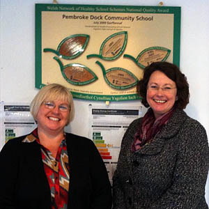 Amanda Edwards, acting assistant head teacher of Pembroke Dock Community School is pictured showing local AM Angela Burns the National Quality Award