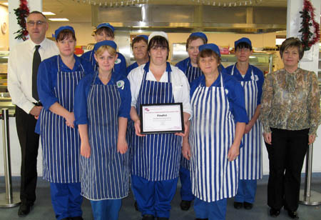 Ian Kemp and Hayley Jones, Denbighshire catering managers with catering staff from Ysgol Brynhyfryd, Ruthin