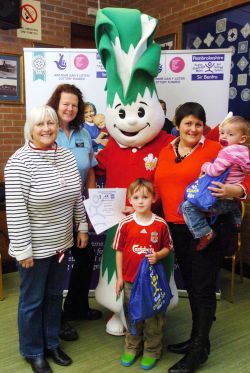 The Williams family from Haverfordwest with Councillor Sian James (left); their Personal Lifestyle coach, Helen Stewart and Lennie the Leek
