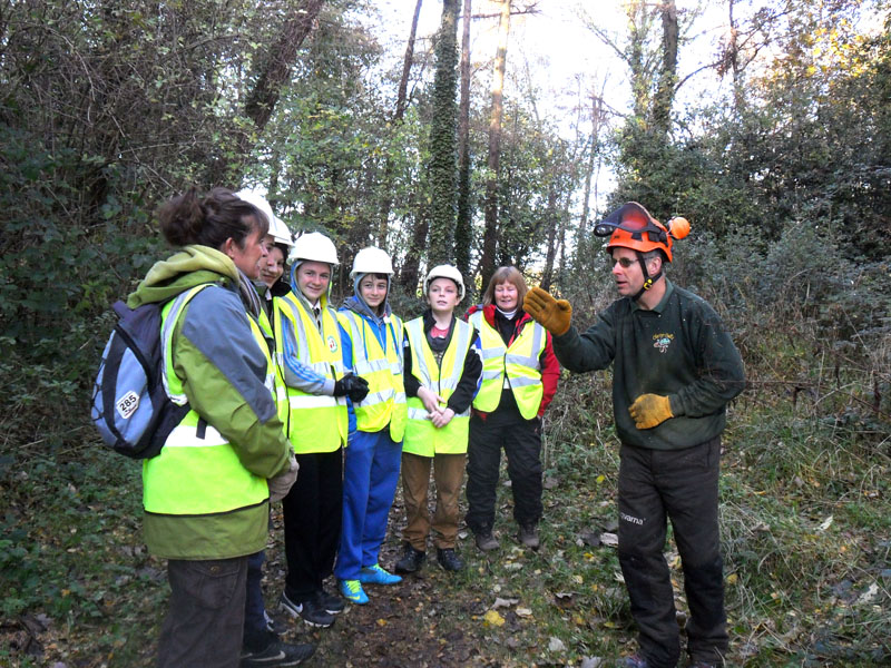 Pupils from Connah's Quay High School with tree surgeon John Joinson