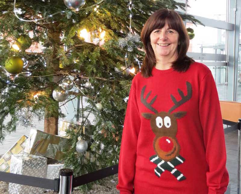 Lesley Griffiths AM wearing a rather fetching Christmas jumper at the Senedd in Cardiff