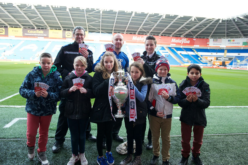 Pictured at the Cardiff City Stadium with pupils from Whitchurch, Gabalfa and Fairwater Primary Schools, are Pcso Gary Dunning, Pcso Christopher Leach and Sergeant Elen Reeves from Fairwater Neighbourhood Policing Team