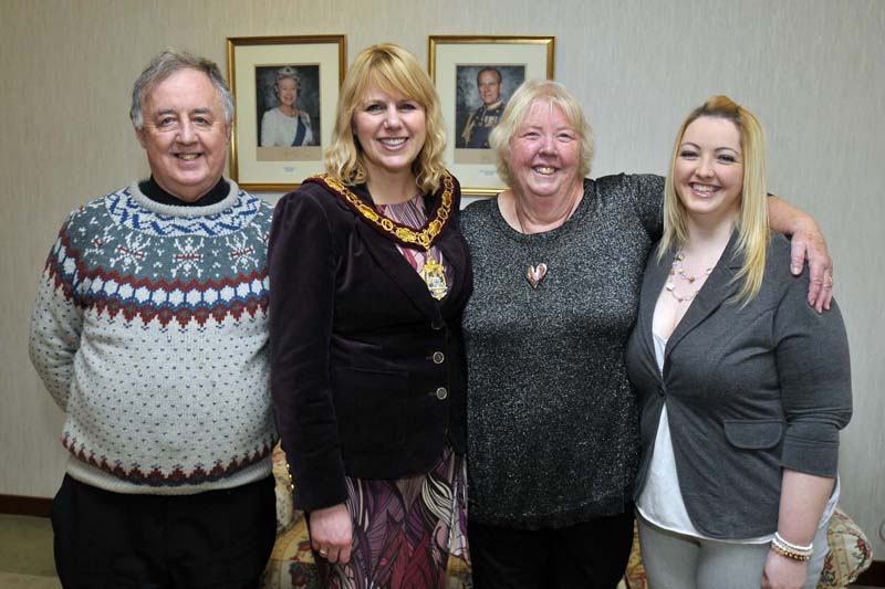 Cllr Carolyn Thomas congratulates Margaret Williams MBE and family