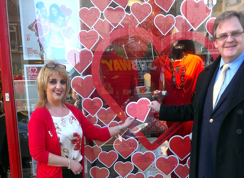 North Wales Assembly Member Mark Isherwood with Yvonne Reid, Assistant Manager at the Mold British Heart Foundation shop supporting the charity’s ‘Ramp up the Red’ campaign