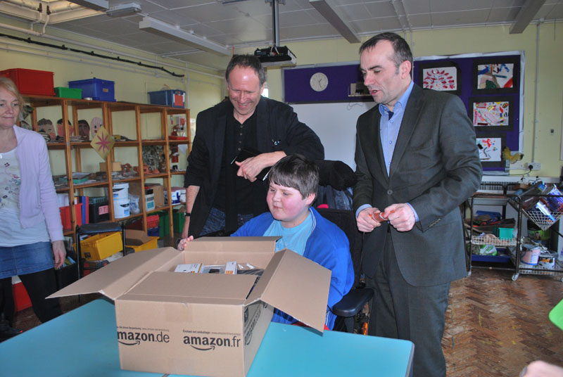 Thirteen year old Lewis Gasson presented with a new lap top thanks to HLM Architects and Loyn & Co Architects