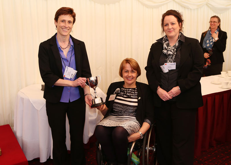 Coleg Gwent sport Lecturers Mererid Dark and Emma Hurley receive the award on behalf of Crosskeys Campus students and staff from Baroness Tanni Grey-Thompson at the House of Lords