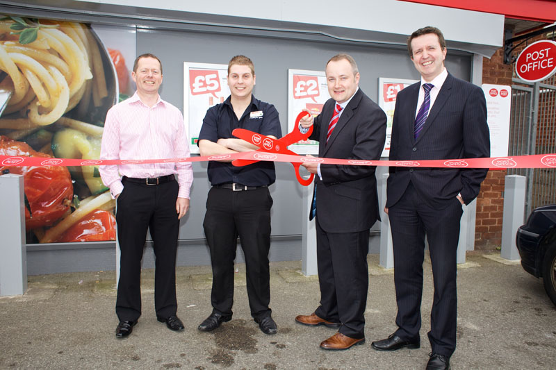 Clwyd West AM Darren Millar  cuts the ribbon at the official opening of the revamped Towyn Post Office