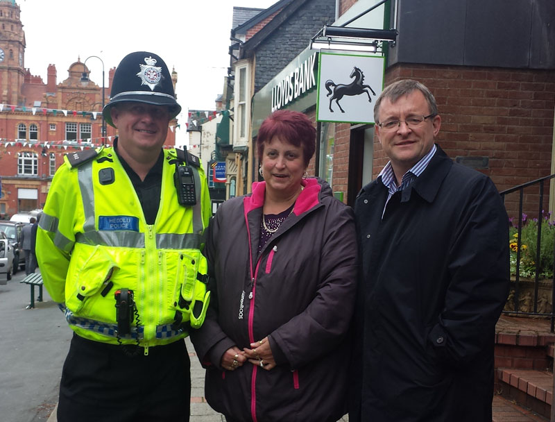 PC Steve Greenwood, Powys County Cllr Joy Jones and William Powell AM in Newtown