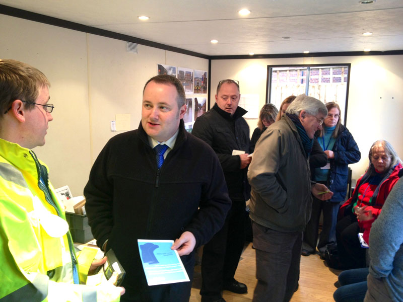  Darren Millar  talking to families and volunteers at the advice centre which was set up at Glasdir, Ruthin following the 2012 floods