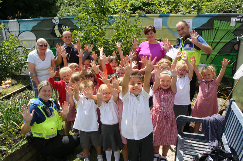 Chair of the allocatment Barbara Turton with staff and pupils from Nant-y-Parc and local community safety officers