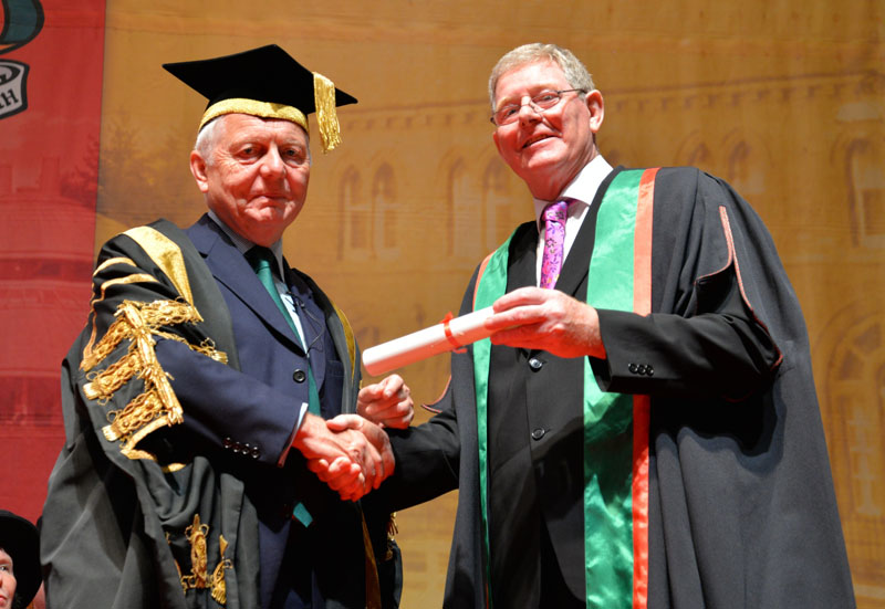 Sir Emyr Jones, President of Aberystwyth University, presents Dr John Sheehy as a Fellow of Aberystwyth University