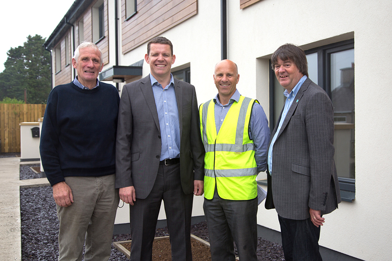 Councillor Peter Rogers, Ynys Mon AM Rhun ap Iorweth, Grŵp Cynefin development manager Huw Evans and John Arthur Jones, chairman of Grŵp Cynefin