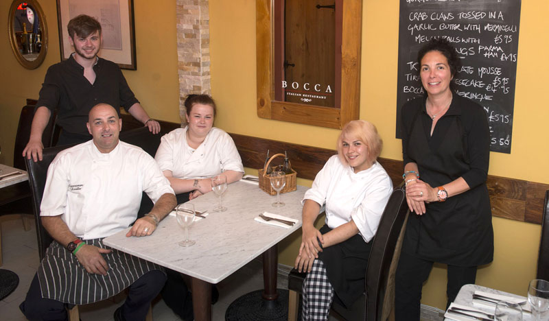 Eamonn Devlin (seated) Head Chef, Charlotte Harper (seated) Kitchen Porter, Francesca Berardi (seated) Commis Chef, James Southers Head Waiter, and Alex Wyatt, owner of Bocca Italian