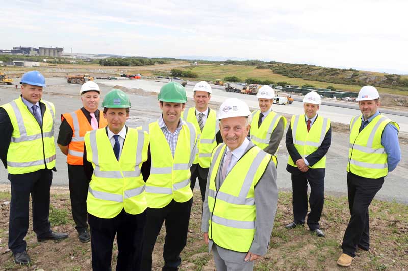 BetFred's Fred Done (right) and Conygar's Freddie Jones (left) get to view their joint venture first hand with Hefin Lloyd Davies of Jones Bros and (back from left) Nigel Jones, Mona Precast, Paul Chaplin, Hanson Concrete, Simon Ismail, BetFred/Roadking, Nick Whatmore, and Kevin Eyers, both Roadking and Trevor Roberts, Watkin Jones