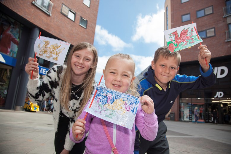 EAGLES MEADOW, WREXHAM CHILDRENS FLAG MAKING WORKSHOP... Pictured are Imogen Lancaster, Nisha Prydden and Joshua Lancaster with their flags.