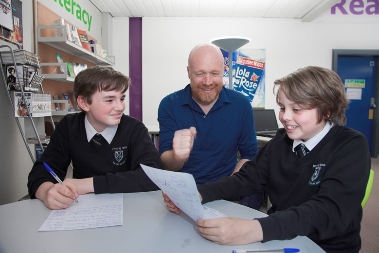 Ysgol Emrys Ap Iwan... Pictured rapping to creative writing is Poet Laureate Martin Daws with pupils Declan Nicholls and Harry Gingell.