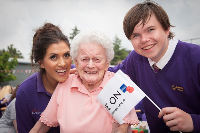 Pendine Park residents invited to St Joseph school to celebrate the Queens 90th Birthday. Pictured  are  Olivia Thomas and Margaret Newell from pendine and St Josephs pupil  Logan Hurst .