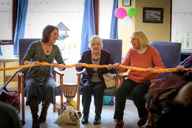 Cefni Hospital, Llangefni.  Music in Therapy sessionn for dementia patients with Christine Eastwood. Pictured: Music Therapist  Christine Eastwood with resident Blodwyn Thomas and Volunteer Gloria Williams