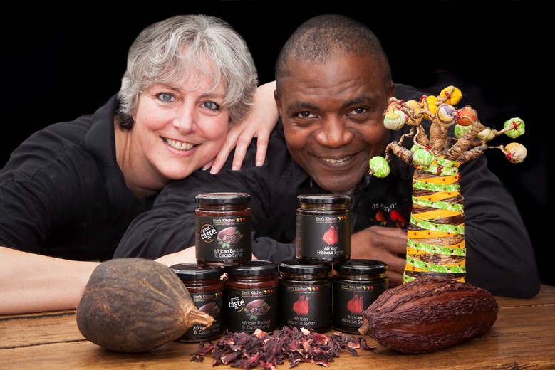 Pictured are Nicola and James  Adedeji from Bim's Kitchen launch two new products (African Baobab & Cacao Syrup and African Hibiscus Syrup) at the Hamper Llangollen food festival .