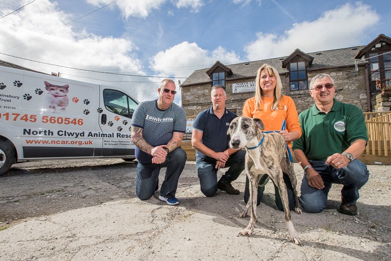 North Clwyd Animal Rescue at Trelogan. John Lyon from Rubicon. John, right is pictured with NCAR fund-raising manager Nicky Owens with Willow with Glynn and David Davies, left. They have presented the centre with £39,000 from their gran Doris’ will, which will be used to build a new cafe for staff & volunteers.