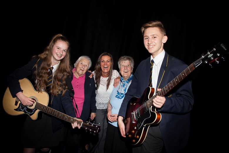 Cartrefi Conwy's Older Person’s Day at Venue Cymru. Pictured are Ysgol John Bright pupils Kayleigh Bonner and Harry Adams who preformed at the event with Lorna Jackson , Nerys Veldhuizen, Cartrefi Conwy's Older Person's Engagement Co-ordinator and Phyllis Parry.