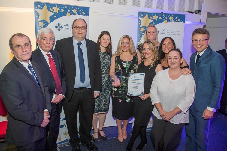 BCUHB Achievement Awards 2016 at Venue Cymru. Geoff Ryall-Harvey and Jackie Allen present the Improving Patient safety award to the Acute Intervention Team, Ysbyty Glan Clwyd pictured with Chief Executive Gary Doherty and chairman Peter Higson