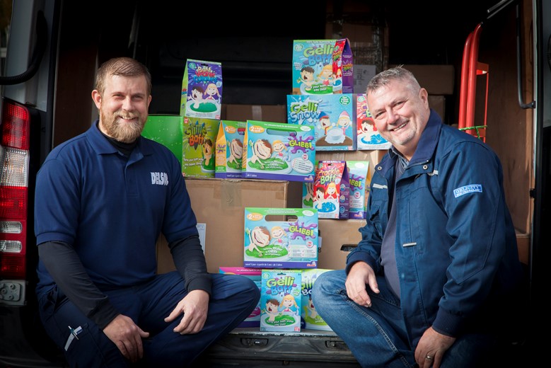 Delsol who deliver  Gelicity Zimpli Childrens bath products around the world. Pictured are Delsol Driver Stuart Reid and Gelicity Managing Director Wayne Walton.