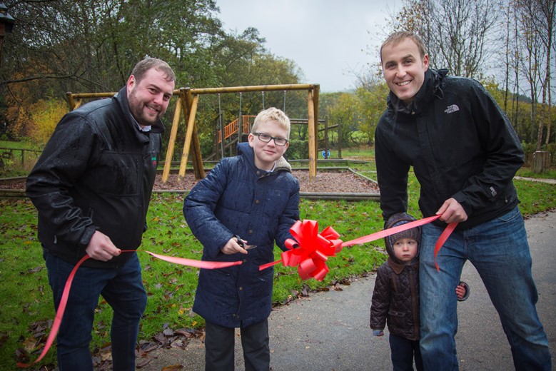 Jack Roberts, 10 who officially opened the new playground in Llanferres Pictured with Rob Williams sales manager from creative play, Gareth Jaggard, secreatary of the playing field association and little Daniel Jaggard.