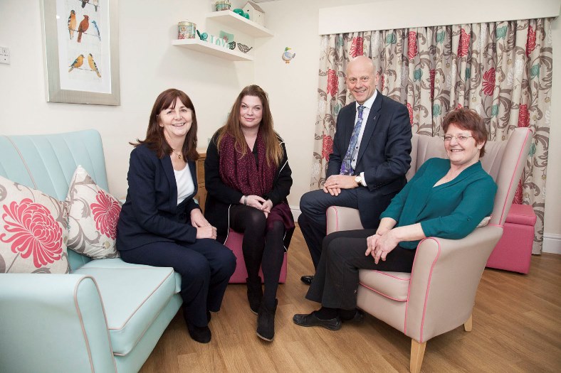 Pendine's Cae Bryn Nursing home in Wrexham has recently had extenstive work carried out for the benefit of the residents. Pictured: Part of the new refurbishment with AM Lesley Griffiths with Manager Jenny Crawshaw, Mario Kreft and Sarah Edwards enjoying the comfort