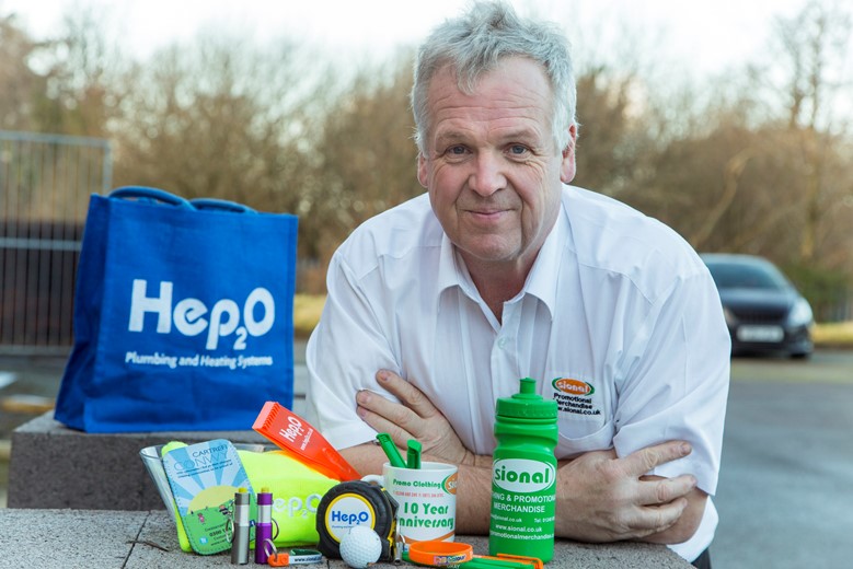 Promotional merchandising company Sional... Pictured is Alan Hughes from Sional with some examples of merchandise.