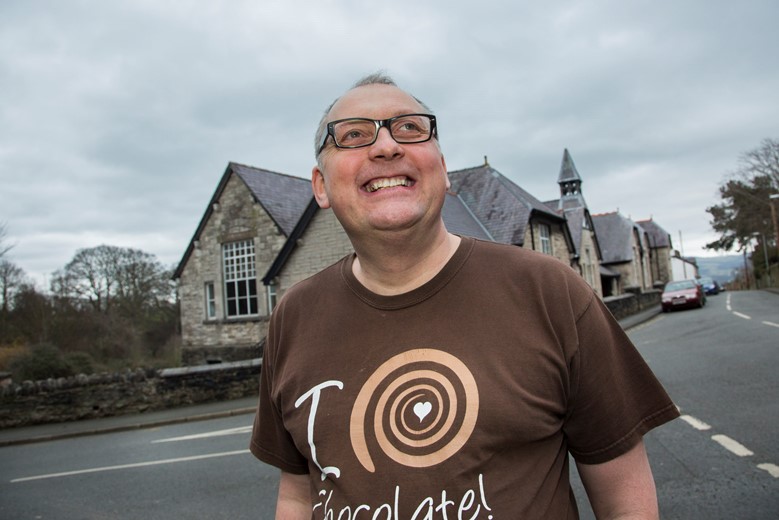 A new heritage walk around Denbigh  in aid of St Kentigen's Hospice, finishing off with a hot drink and some cake....Pictured is Mark Young from the chocolate shop at Denbigh Museum and Old court House one of the points of interest .