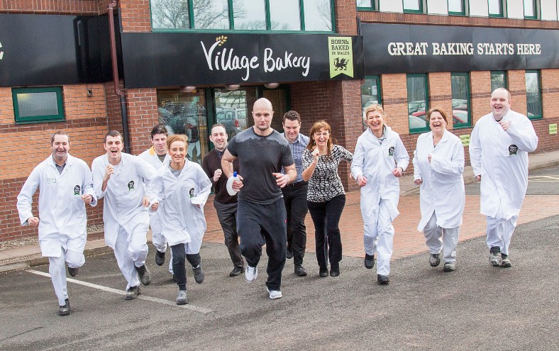 The Village Bakery staff in Coedpoeth prepare for the Village Bakery Half Marathon. Pictured: Jake Longworth (centre) ready for training along with the support of some of his many colleagues