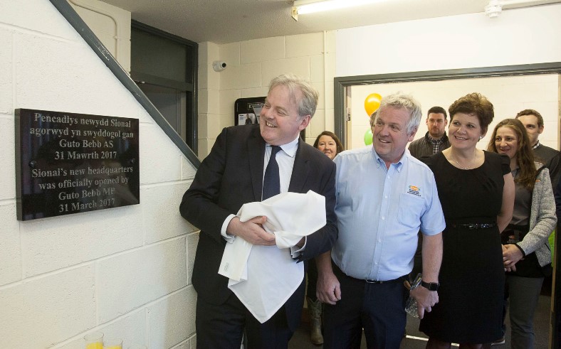 Sional Promotional Merchandise Ltd in Llanfairfechan officially open their new premises for business with MP Guto Bebb. Pictured: Guto Bebb unveils the plaque